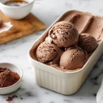 Ninja creami chocolate ice cream scooped into a ceramic bowl